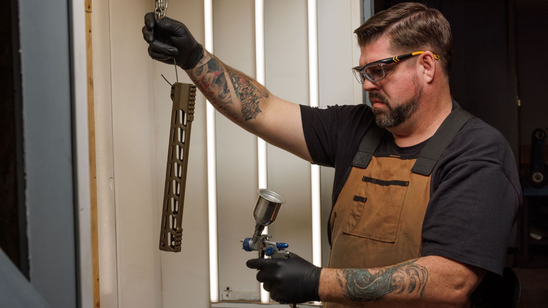 man doing gunsmith work