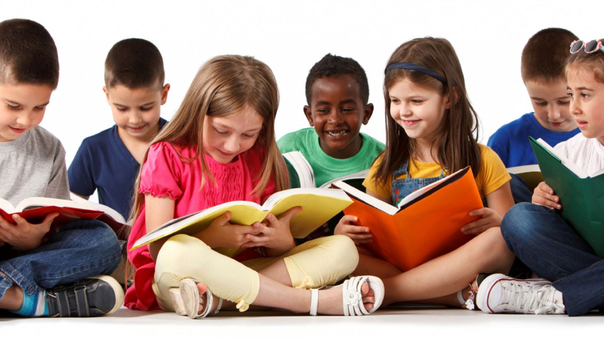 group of children reading books